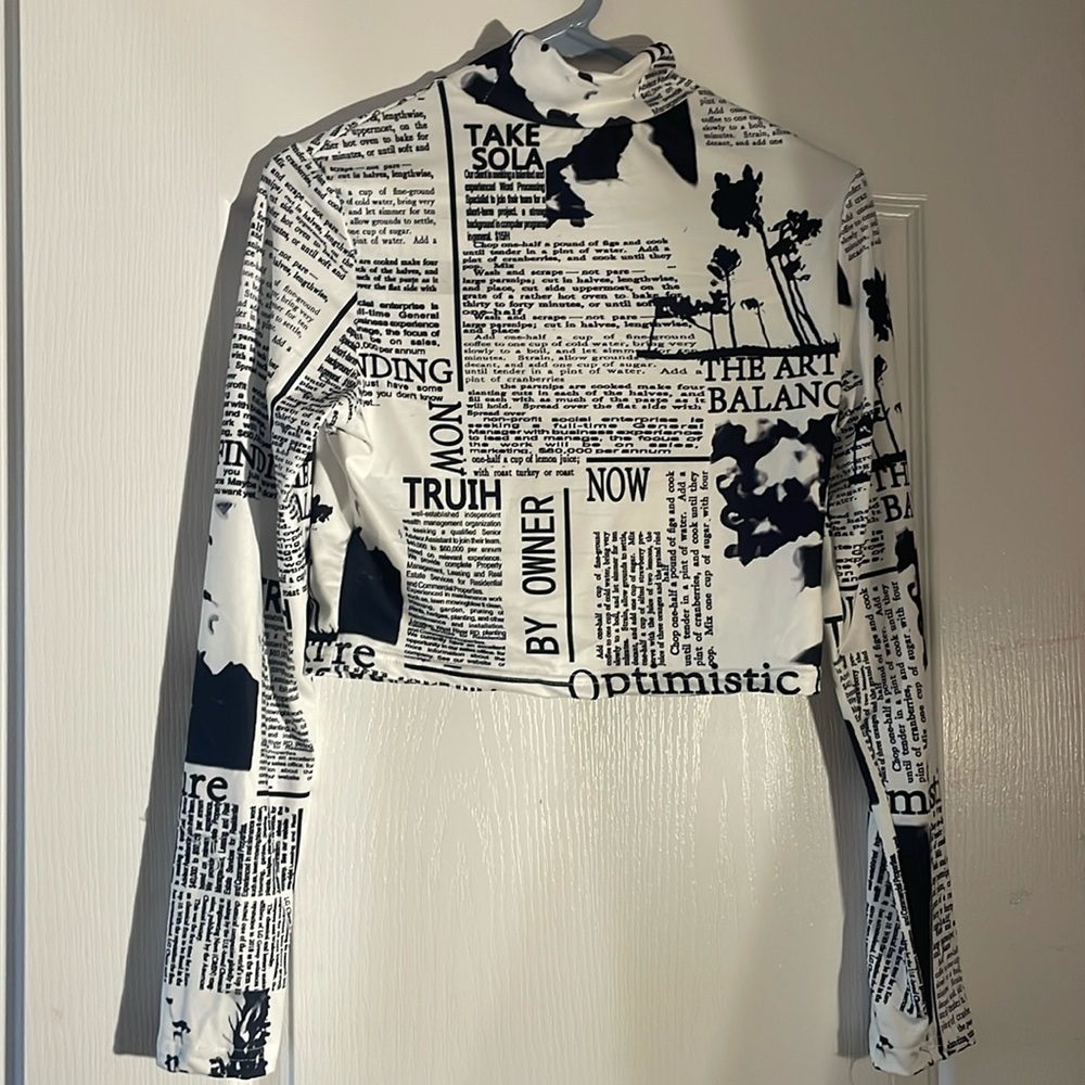 long sleeve newspaper turtle neck cropped top